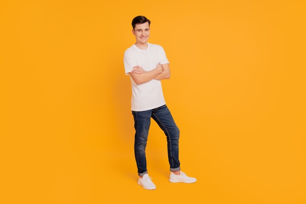 Full size photo of professional man cross hands on yellow background