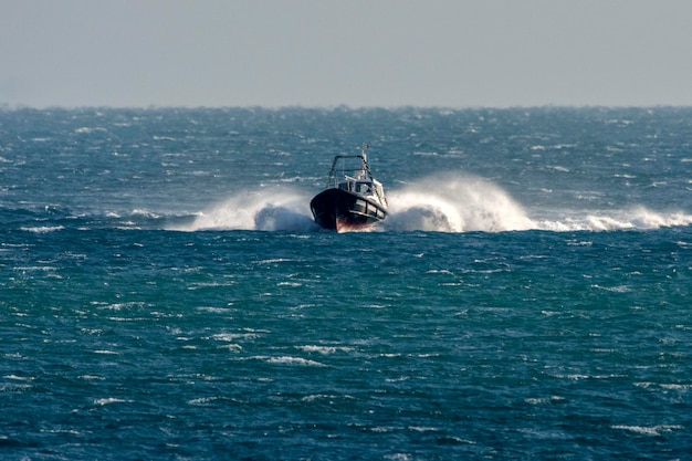 Full speed boat on rough sea