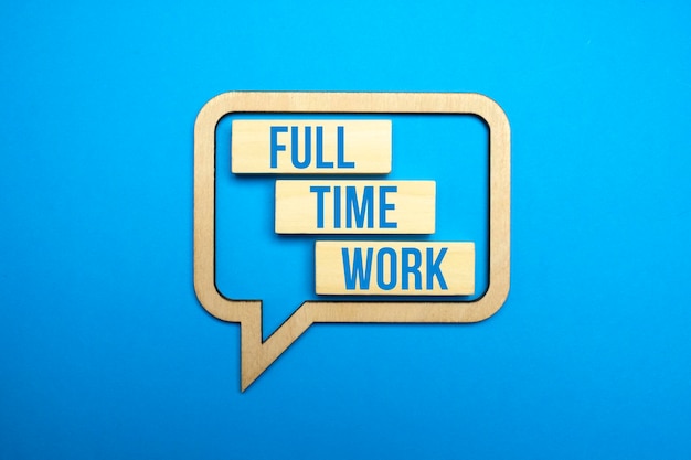 FULL TIME WORK symbol Wooden blocks with words 'Full time work' on blue background