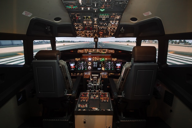 Full view of cockpit modern Boeing aircraft before take-off.