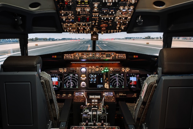 Full view of cockpit modern Boeing aircraft before take-off.