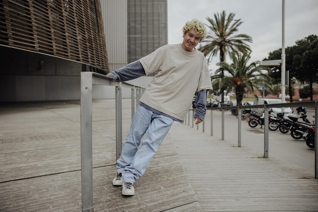 Full view of stylish man smiling at camera