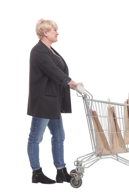 Fulllength casual mature woman with shopping cart