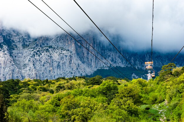 Funicular paths pass by picturesque thickets background mountains