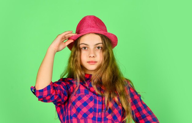 Funky beauty happy childhood small girl follow latest trends pure and natural beauty child has long hair hipster girl wear retro hat stylish kid looking retro checkered fashion for teen