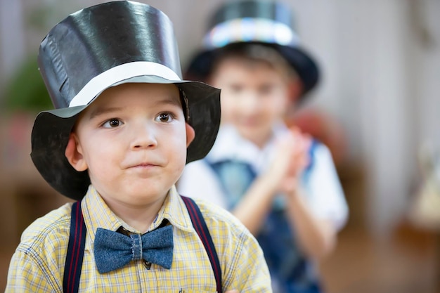 Funny boy in a bowler hat Portrait of a five year old child