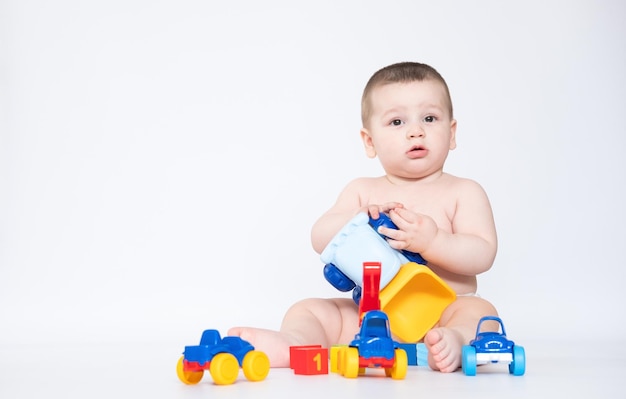 Funny boy kid playing with toy