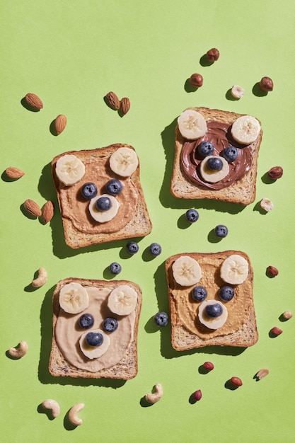 Funny children bear toasts with nuts butters