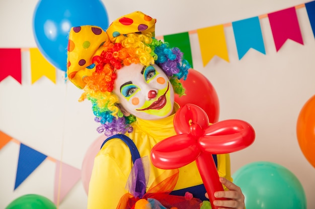 Funny clown at a colorful party