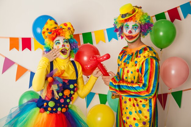 Funny clowns at a colorful party