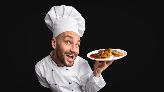 Funny Cook Man Showing Chicken Dish Panorama Studio Shot