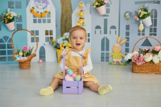 Funny cute girl in bunny ears celebrating Easter