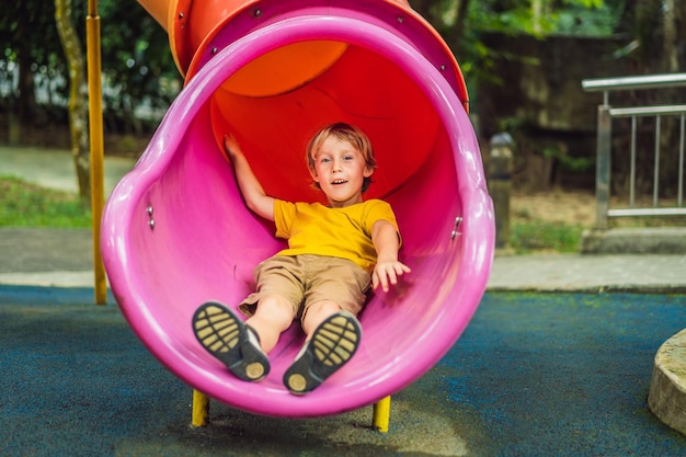 Funny cute happy baby playing on the playground The emotion of happiness fun joy