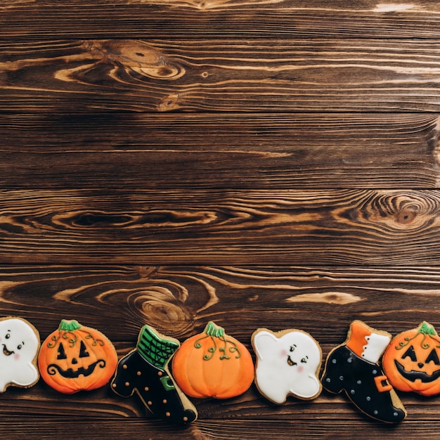 Funny delicious ginger biscuits for Halloween on the table. horizontal view from above