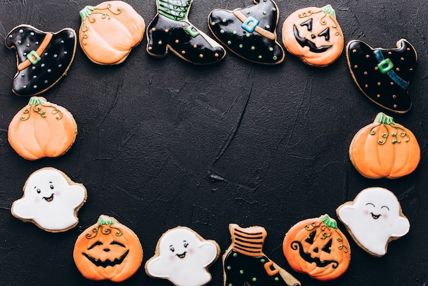 Funny delicious ginger biscuits for Halloween on the table. horizontal view from above