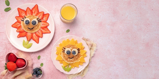 Funny flower pancake with berries for kids