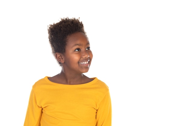 Funny kid with afro hair isolated on a white wall