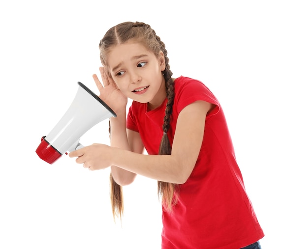 Funny little girl with megaphone on white 