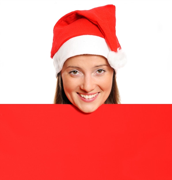 A funny portrait of Santa's helper holding a red empty board against white