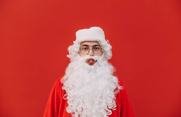 Funny Santa Claus on a red background