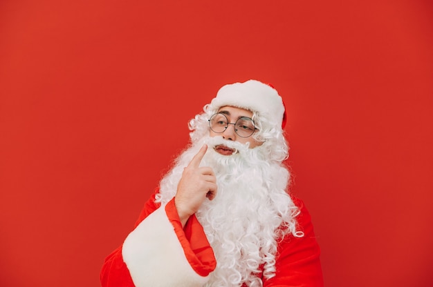 Funny Santa Claus on a red background