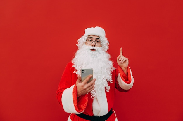 Funny Santa Claus using a phone