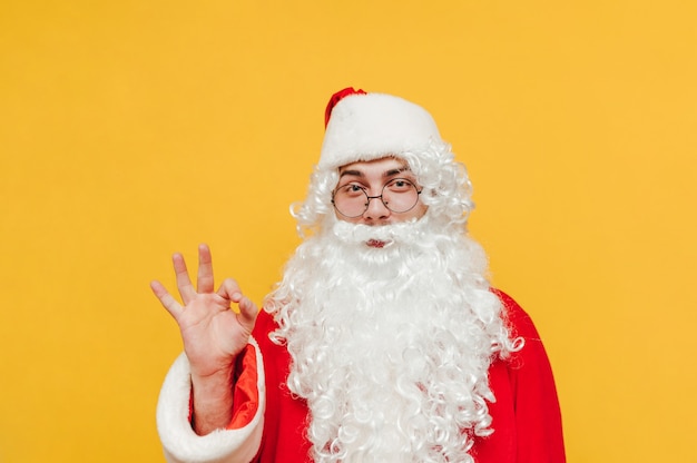 Funny Santa Claus on a yellow background