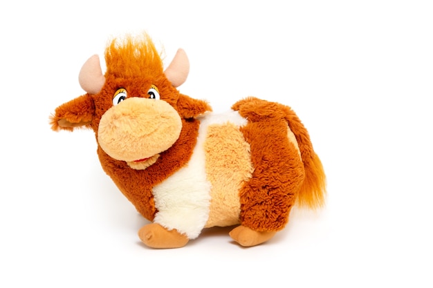 Funny soft toy bull that smiles. Symbol of the year