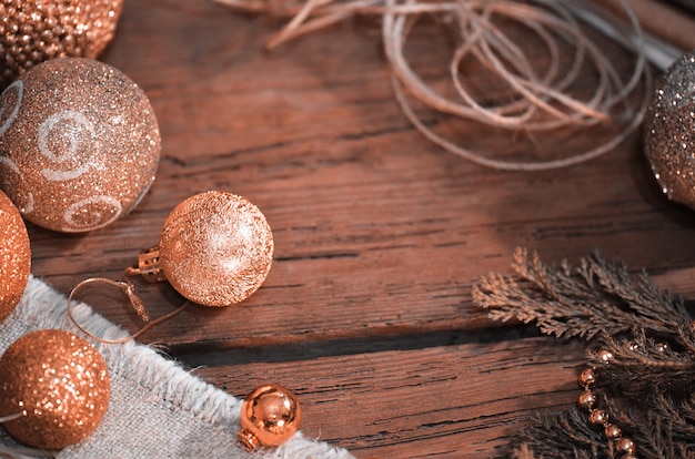 Fur tree branches, balls, rope on rustic wooden table