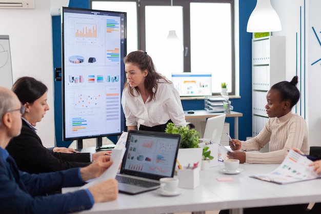 Furious woman screaming at company office boardroom meeting having disagreement controversy