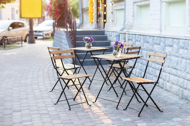 Furniture for coffee shop in street in Europe in summer