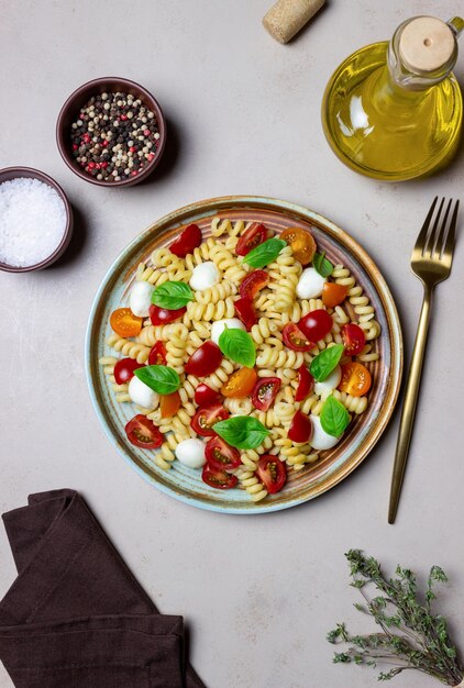 Fusilli pasta with mozzarella tomatoes and basil Italian food Healthy eating Vegetarian food