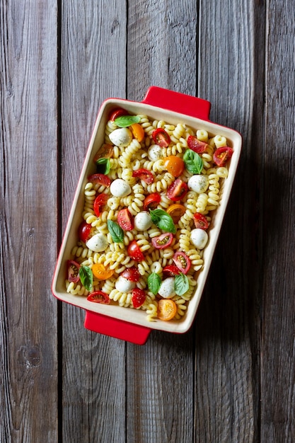 Fusilli pasta with mozzarella tomatoes and basil Italian food Healthy eating Vegetarian food