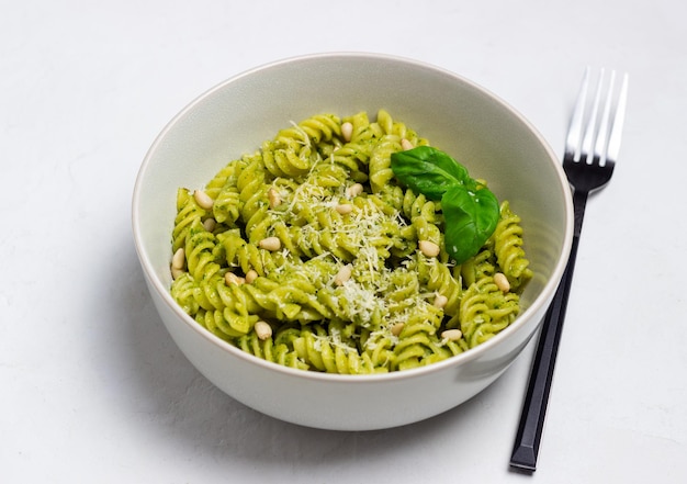 Fusilli pasta with pesto sauce cheese and nuts Healthy eating Vegetarian food Italian cuisine