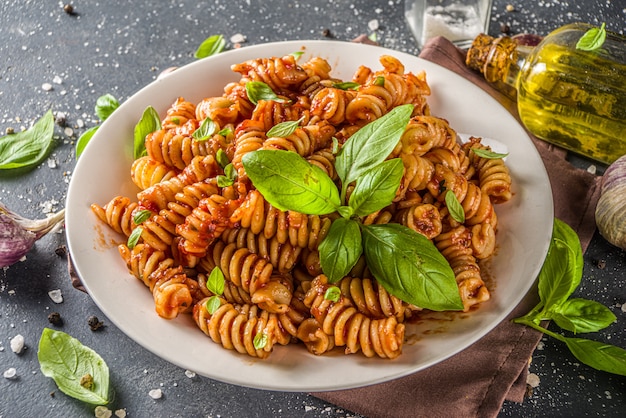 Fusilli pasta with tomato sauce and basil. Traditional italian Fusilli pasta marinara