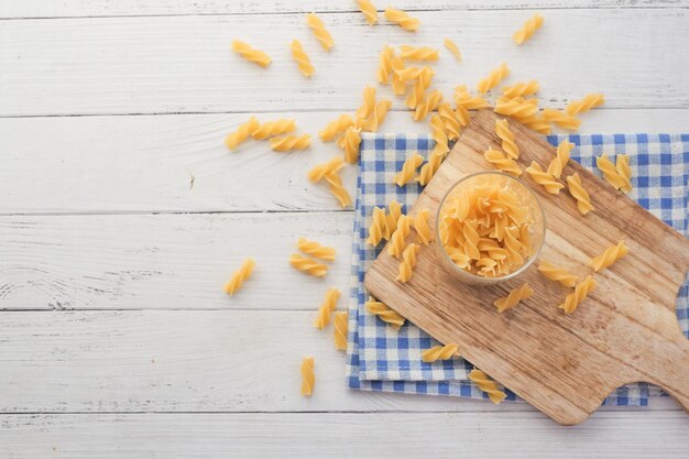 Fusilli spaghetti in a jar on table top view