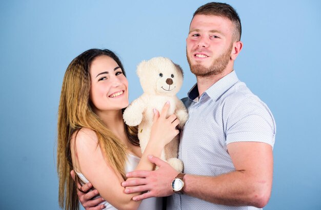 Future parents. valentines day present. sexy girl and man hold teddy bear. romantic relationship. love date. man and woman embrace. couple in love. family relations and happiness. family values.