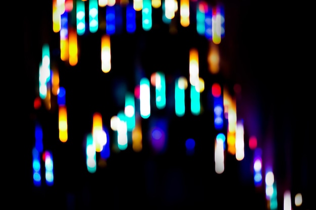 Futuristic abstract neon light shapes on black defocused boke background