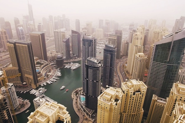 Futuristic aerial view of residential skyscrapers in the Dubai Marina walk. Dubai