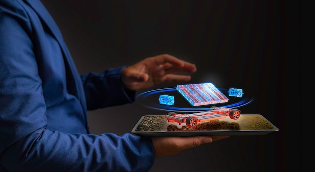 a futuristic business man is holding a digital tablet future concept from hologram