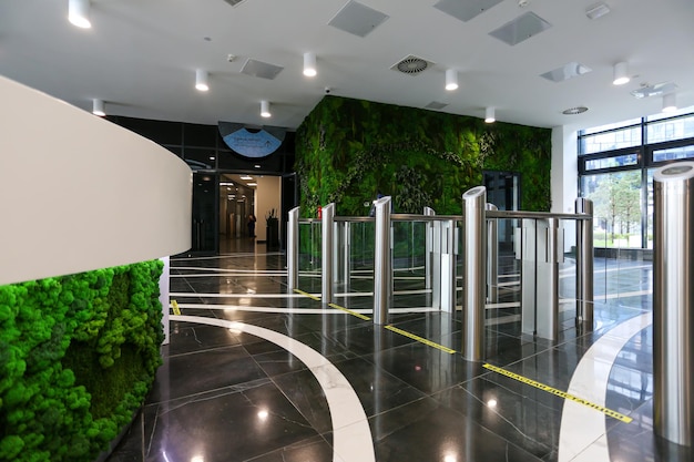 Futuristic green hall with the entrance doors and reception desk