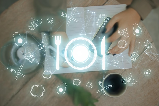 Futuristic restaurant menu application concept with glowing silverware hologram