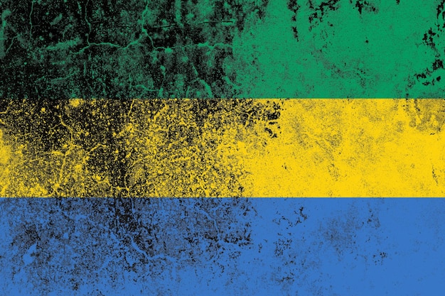 Gabon flag on a grungy old concrete wall surface