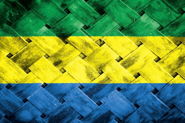 Gabon flag screen on wicker wood background