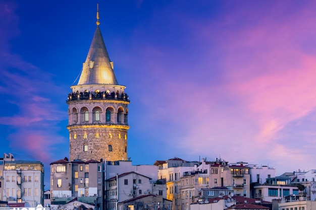 Galata Tower at twilight Galata Tower in Istanbul beautiful landmark at evening Galata tower at Karakoy district and Golden Horn Turkiye istanbul Turkey