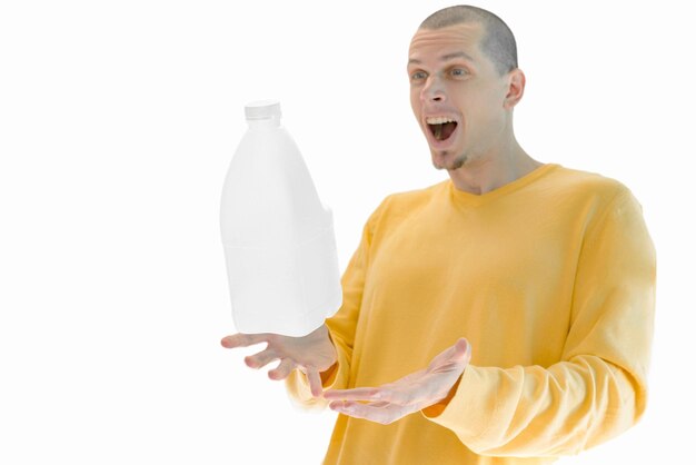 A gallon of milk flying above hands of surprised man isolated on a white background White plastic Appetite Nourishment Cuisine Shop Food Eating Calcium Daily Nutrient