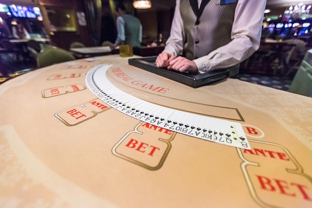 Gambling chips and cards on a game table roulette