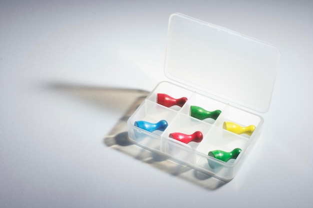 Game Pieces in Plastic Container