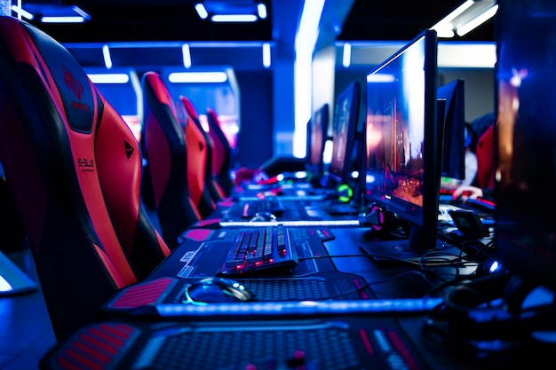 Game room interior with powerful super computers consoles keyboards for playing video games