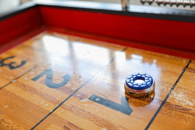 A game table with a blue cap on it and a number 2 on it.